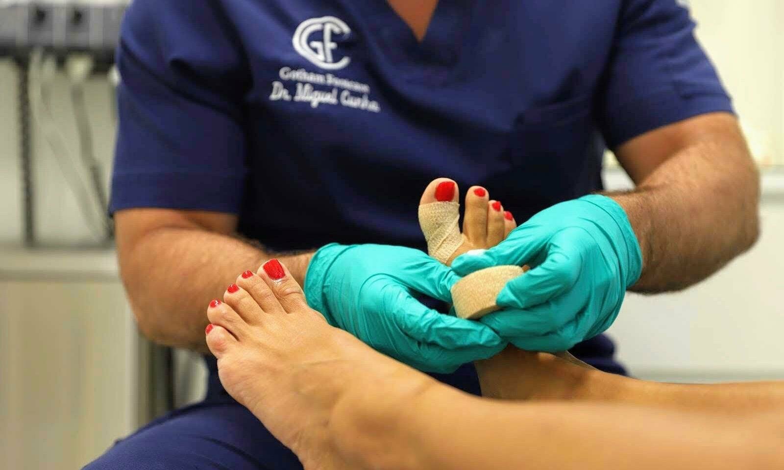 podiatrist working with foot