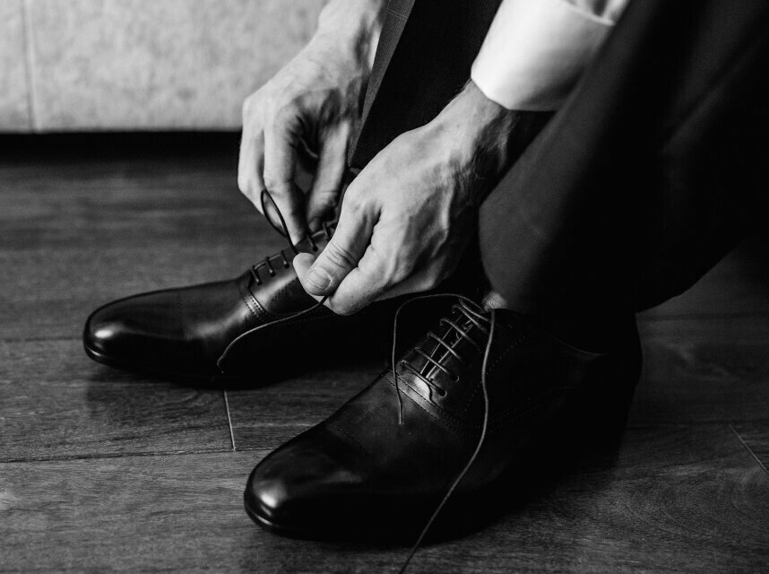 NYC podiatry patient tying shoes