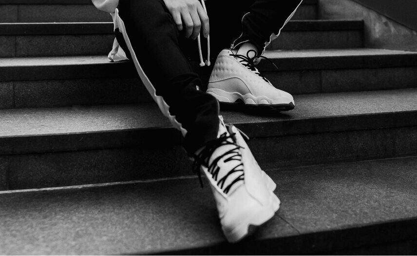 NYC Cosmetic Footcare patient sitting on steps